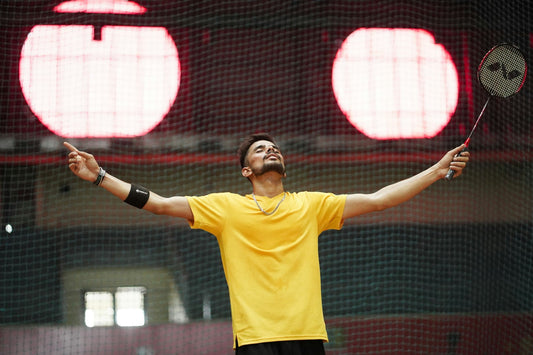 Badminton player demonstrating immense strength and endurance on court
