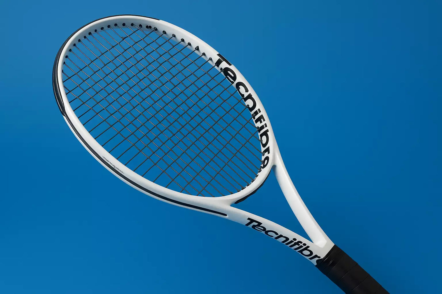 Tecnifibre tennis racket with Tecnifibre Razor Soft strings on a blue background