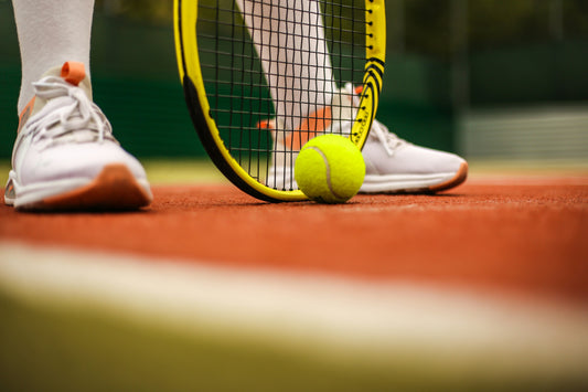 Tennis player thinking about restringing their racket