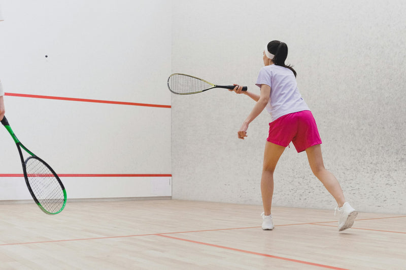 Squash player pondering what string tension is all about
