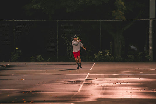 Tennis player deliberating the perfect string tension for their game