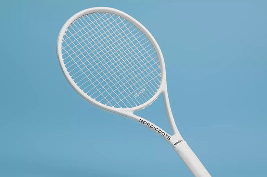 Nordicdots Model 100 tennis racket in white with Nordicfots ES125 strings in white, wit\h a blue background and anti clockwise racket orientation to the left