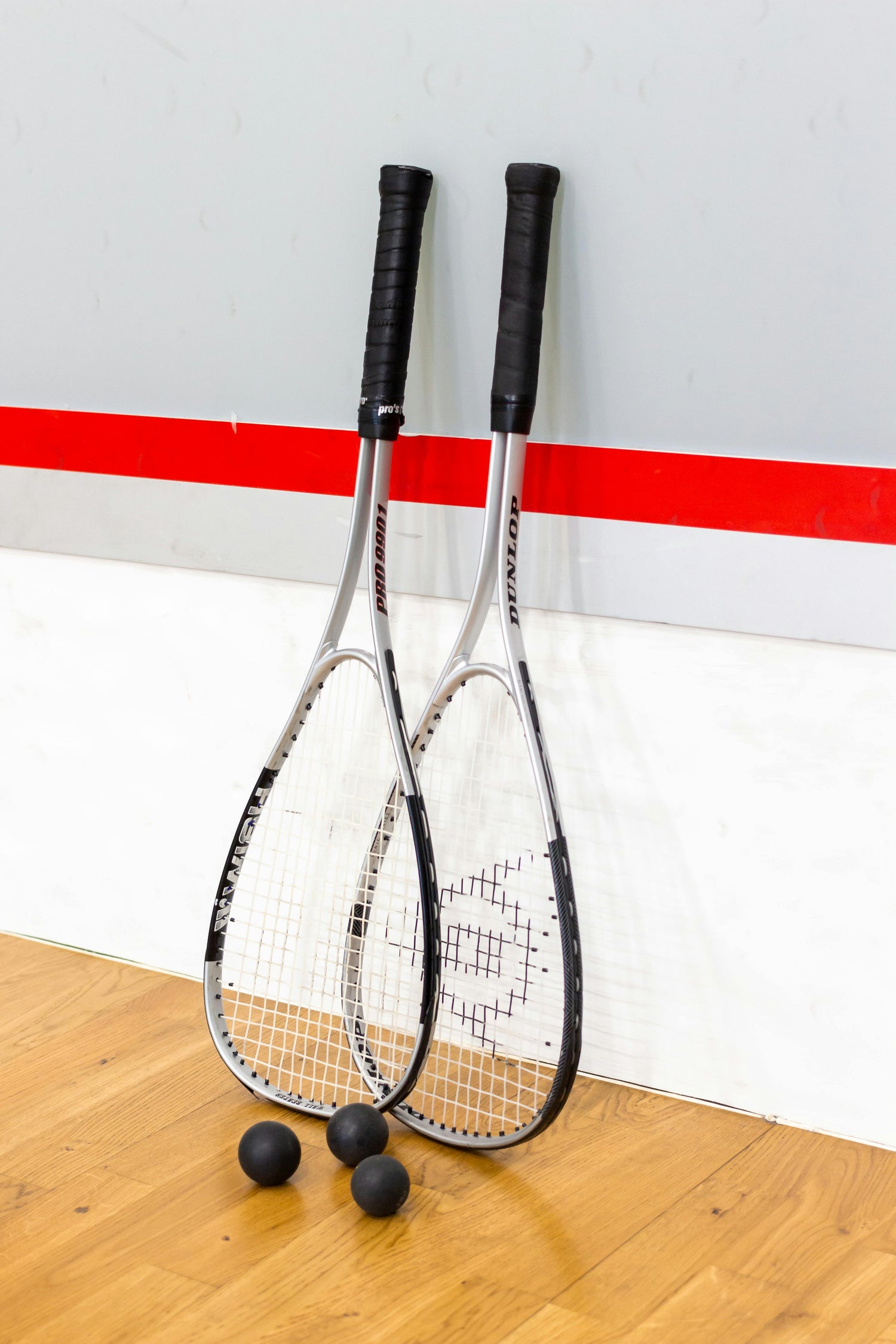 Squash rackets on squash court