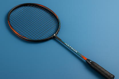 Yonex Astrox badminton racket with Yonex BG66 Ultimax strings in back on a blue background
