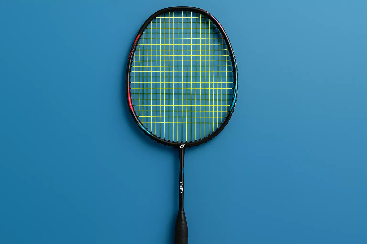 Yonex badminton racket with Yonex BG80 strings in yellow on a blue background