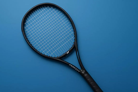 Yonex Percept 97 tennis racket with Kirschbaum Gut Feeling strings in clear, on a blue background with an anti-clockwise racket orientation
