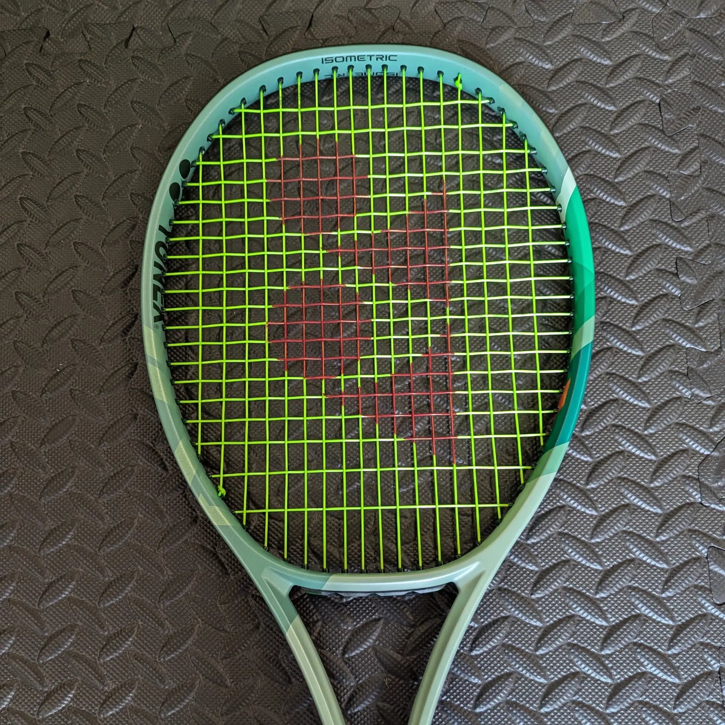 Yonex Percept tennis racket with Solinco Hyper G Soft strings and a red Yonex stencil