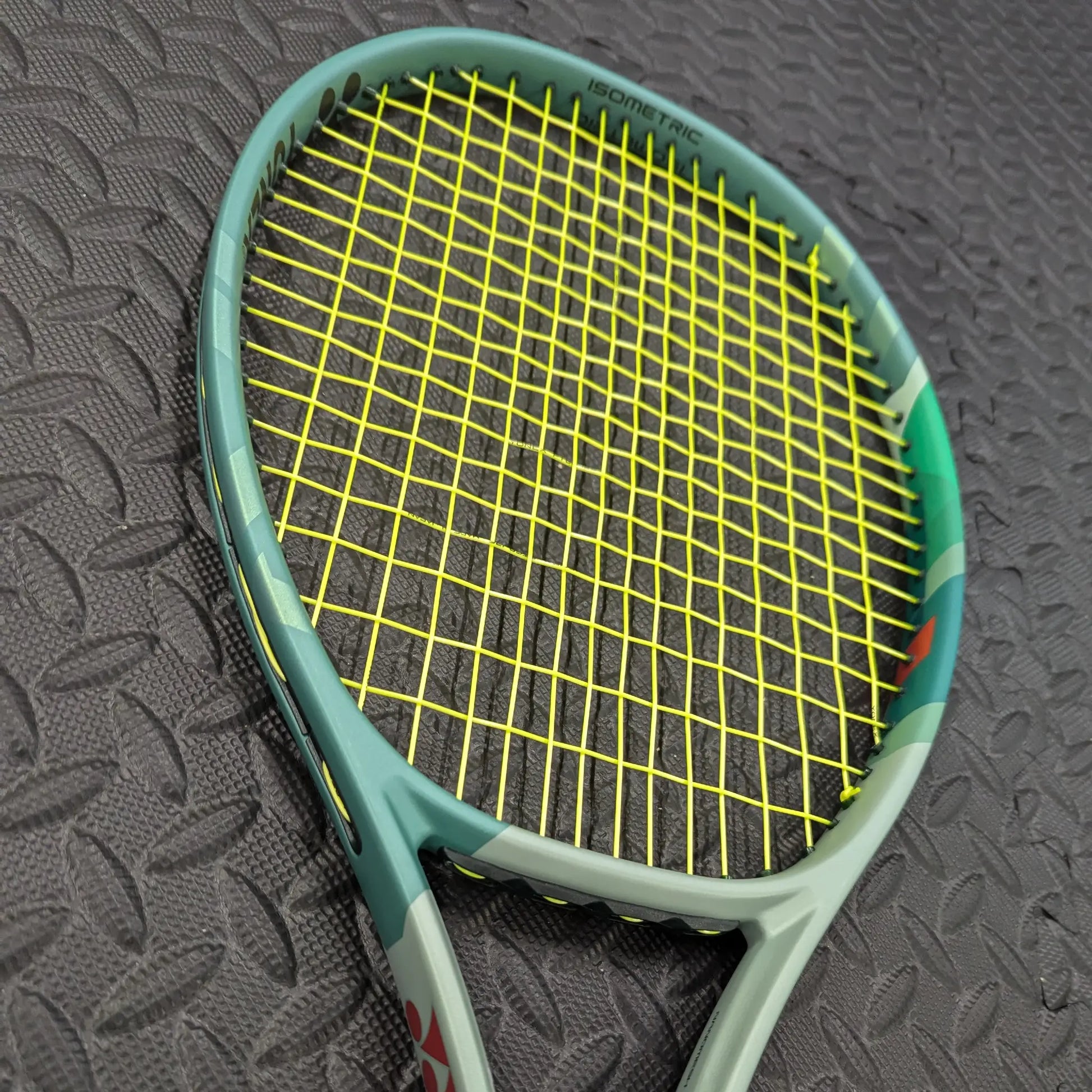 Yonex Percept tennis racket with Yonex Poly Tour Pro strings in yellow